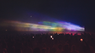 Photo of colourful lights and a large crowd at Simple Things 2024